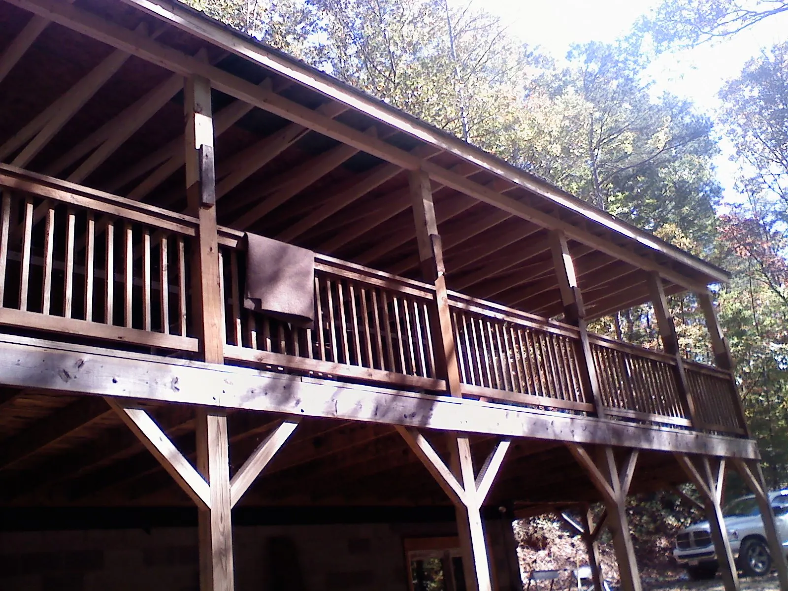 Timber framing under a new elevated porch and deck in Waltham